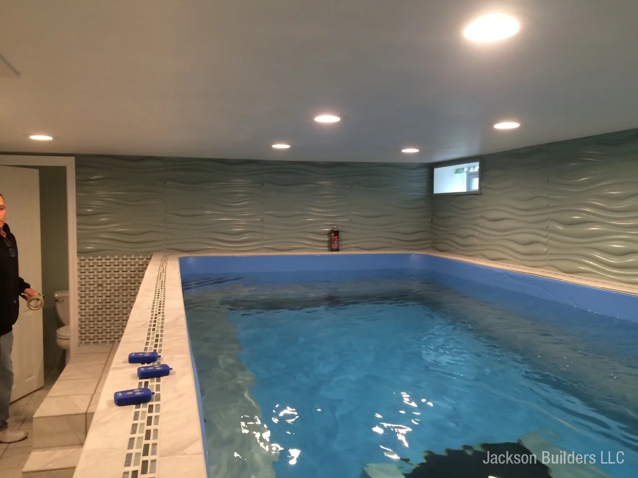 Endless Pool installation with retractable enclosure and custom deck — Jackson Builders project photo 23