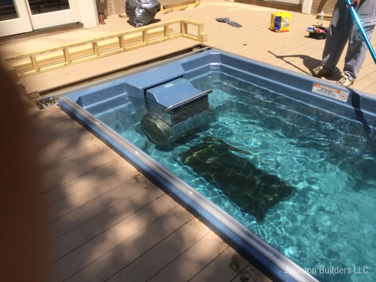 Endless Pool installation with retractable enclosure and custom deck — Jackson Builders project photo 12
