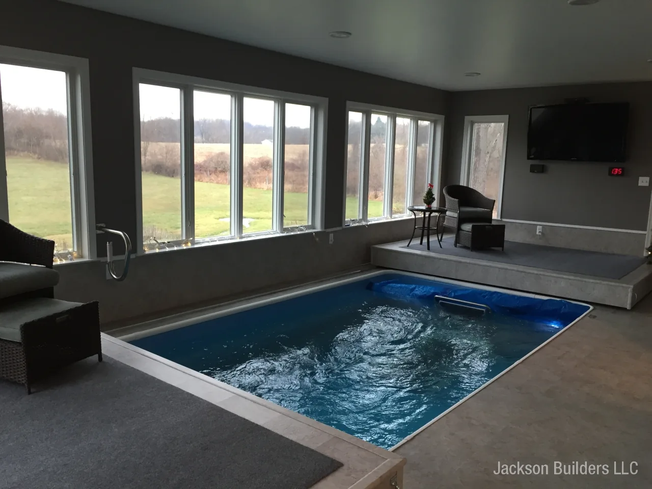 Endless Pool installation with retractable enclosure and custom deck — Jackson Builders project photo 7
