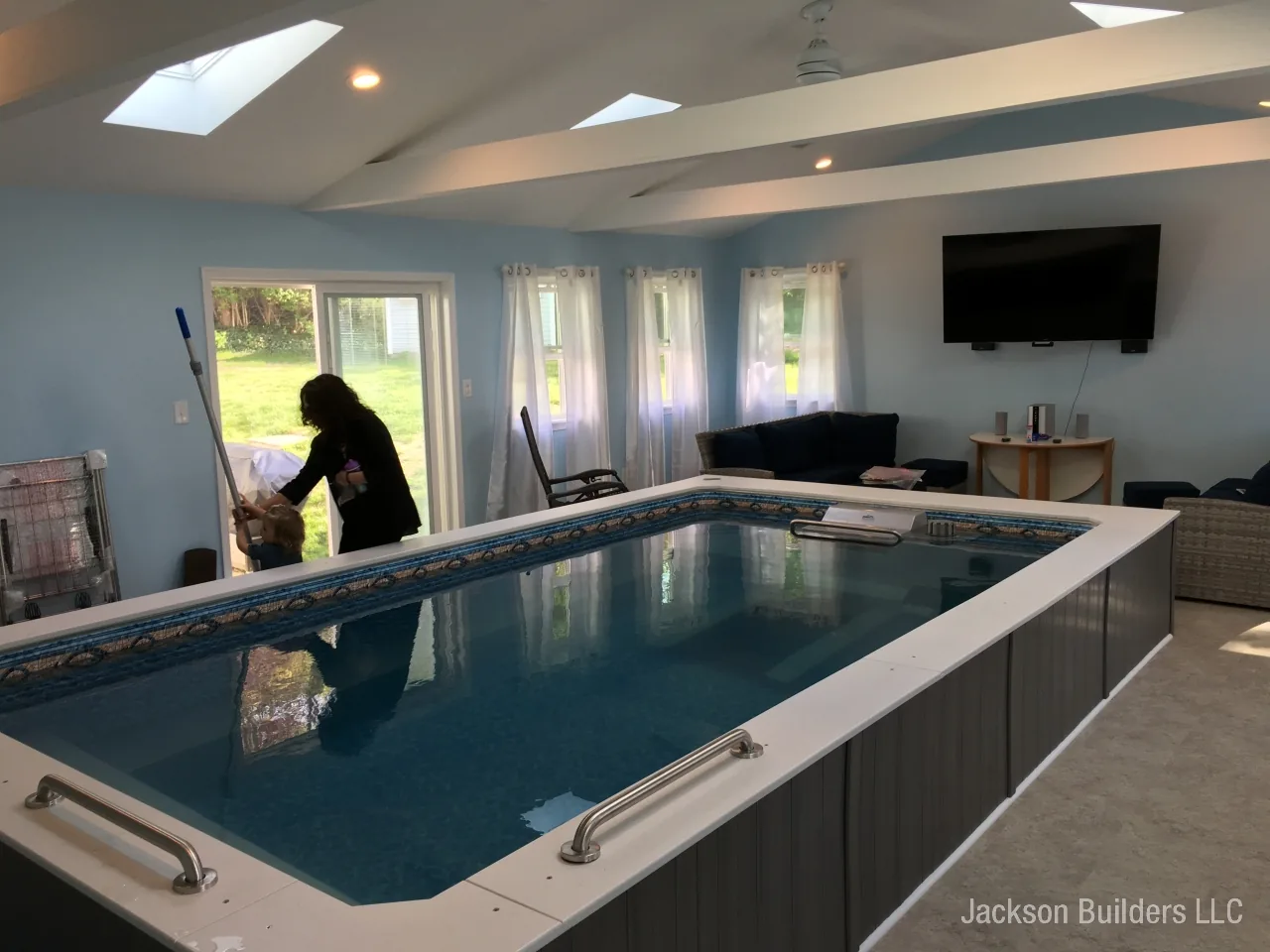 Endless Pool installation with retractable enclosure and custom deck — Jackson Builders project photo 26