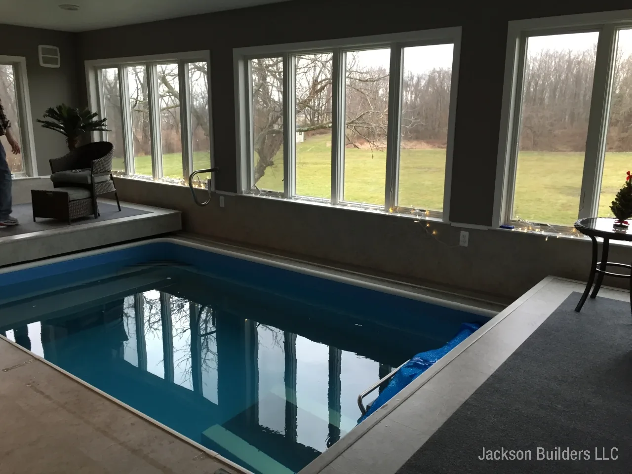 Endless Pool installation with retractable enclosure and custom deck — Jackson Builders project photo 15
