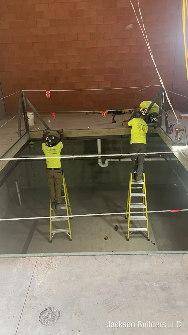 Indoor Endless Pool installation in progress with structural steel framing — Jackson Builders project photo 4