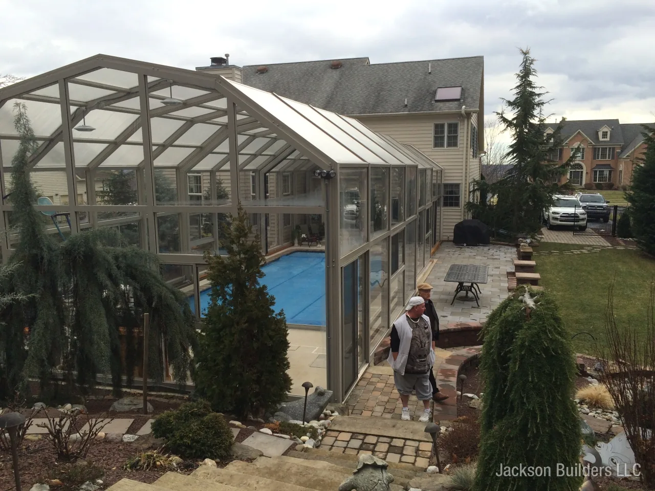 Endless Pool installation with retractable enclosure and custom deck — Jackson Builders project photo 22